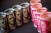 U.S. one-hundred dollar banknotes and Chinese one-hundred yuan banknotes are arranged for a photograph in Hong Kong, China, on Monday, April 15, 2019. China's holdings of Treasury securities rose for a third month as the Asian nation took on more U.S. government debt amid the trade war between the world’s two biggest economies.