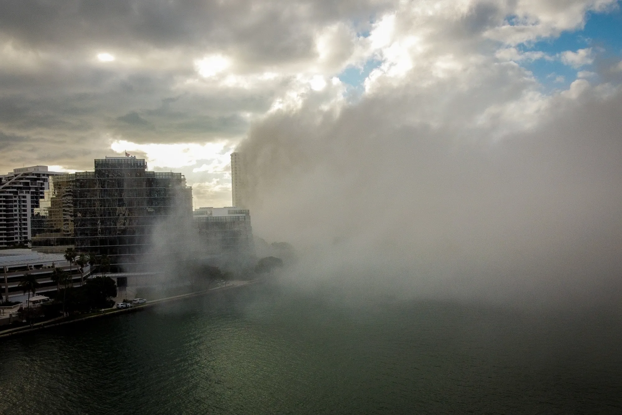 A cloud of dust and smoke filling the Brickell neighborhood following an implosion of the former Mandarin Oriental hotel on April 12.