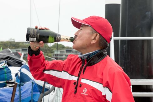Billionaire Karl Kwok celebrates his yacht Beau Geste's win at the 2015 Audi Hamilton Island Race Week.