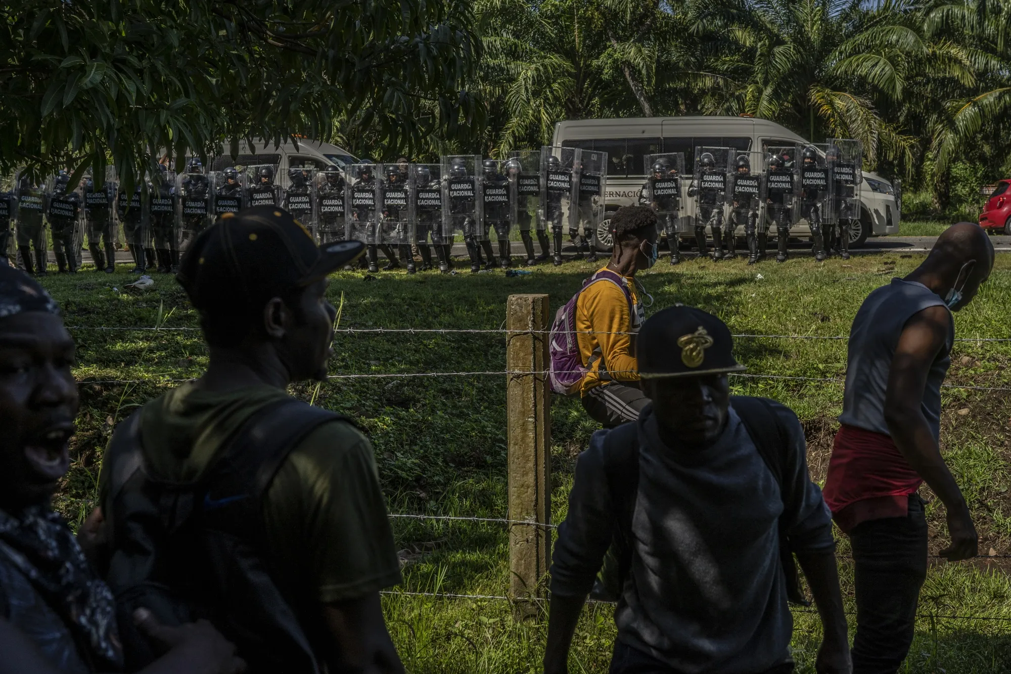 National guards walk towards Haitian migrants during a raid in Chiapas, on Sept. 2, 2021.