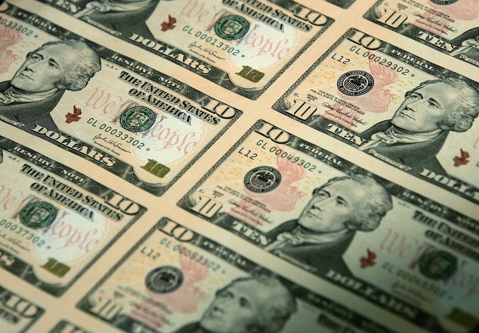 WASHINGTON - MARCH 2: An uncut sheet of the redesigned $10 bill is seen after a news conference to commemorate the first day of circulation of the new notes at the National Archives March 2, 2006 in Washington, DC. The new $10 note is the latest issue in the new series of U.S. currency, with features including color-shifting ink, watermark and security thread which are easy to check by naked eye.
