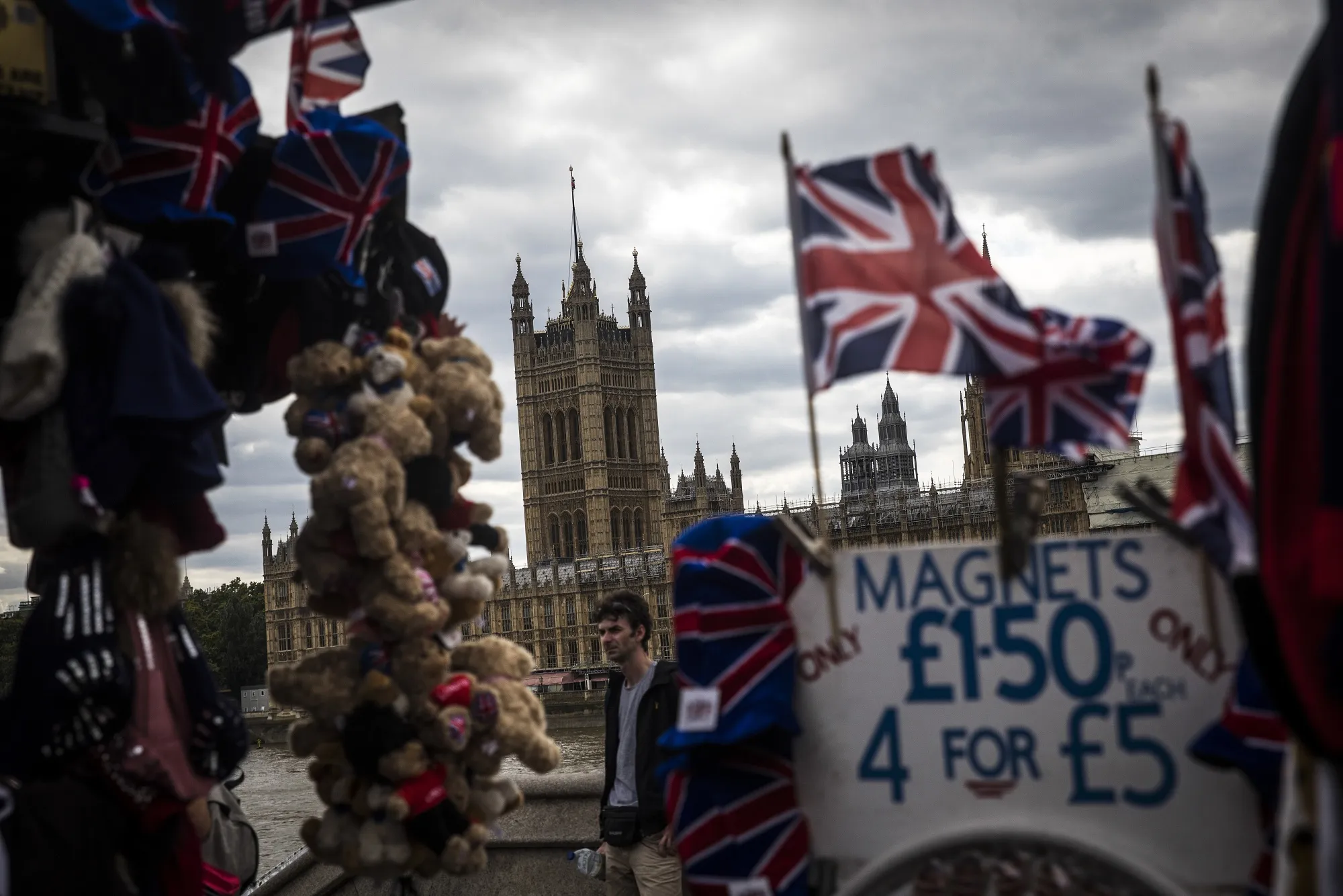 A souvenir stall sits in view of the Houses of Parliament in London.