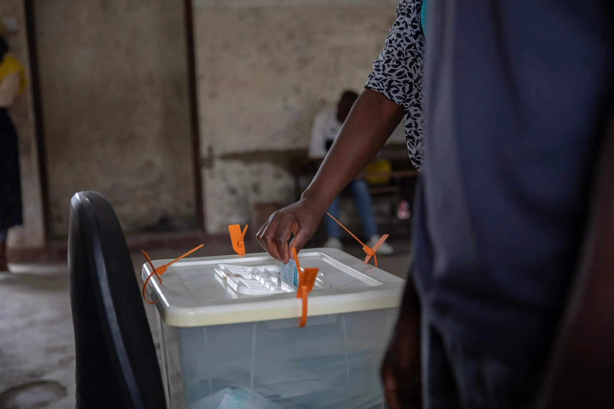 A voter casts a vote in a polling station in Maputo on Oct.&nbsp;11.