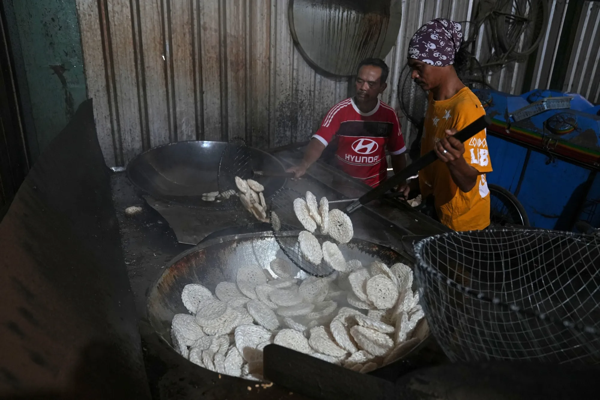 Workers deep fry Kerupuk crackers at a&nbsp;factory in Jakarta, Indonesia, on&nbsp;April 20.&nbsp;
