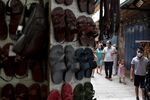 People walk past shops in Jerusalem's Old City on May 23.