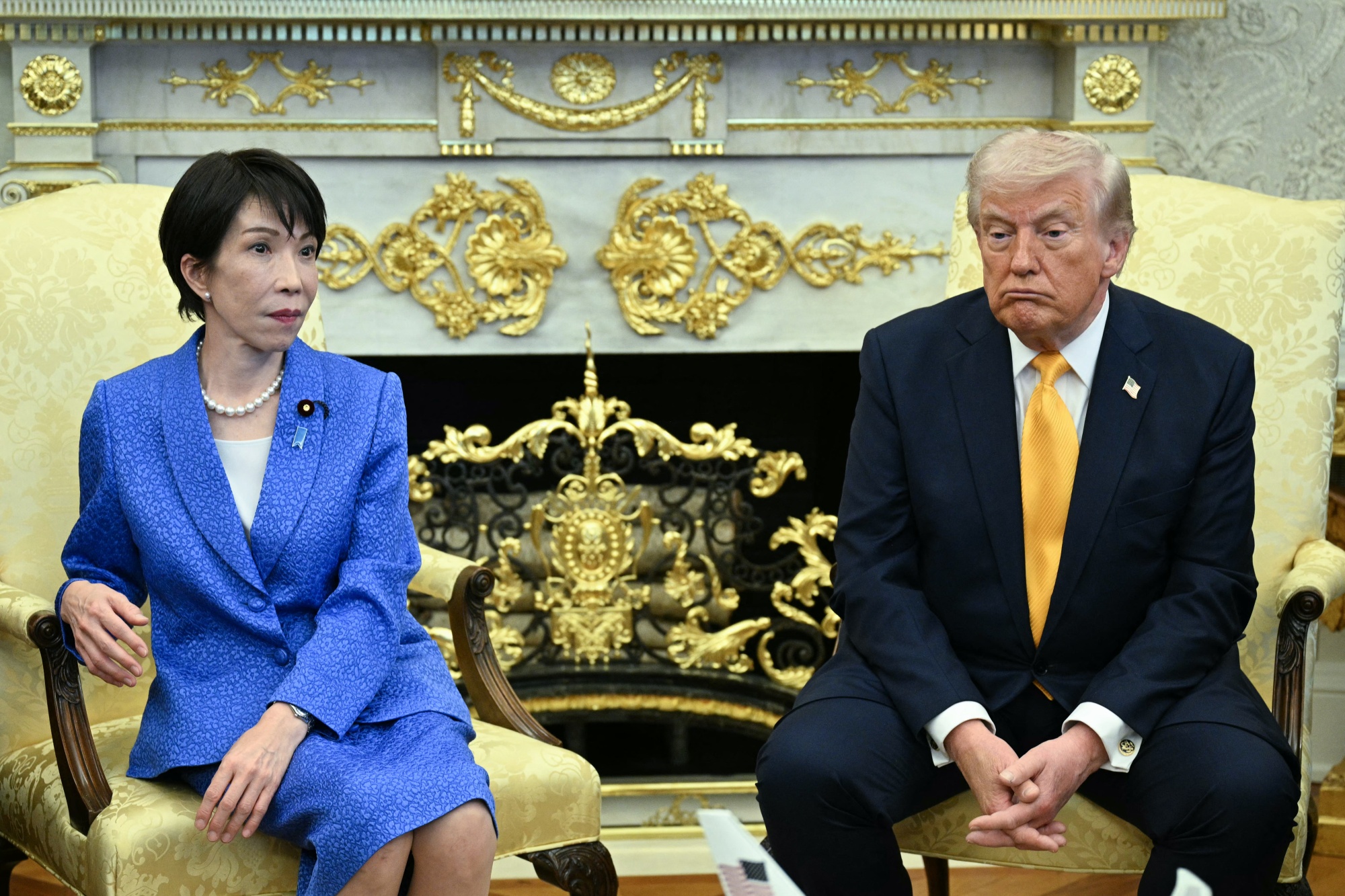 TOPSHOT - US President Donald Trump meets with Japan's Prime Minister Sanae Takaichi in the Oval Office of the White House in Washington on March 19, 2026. (Photo by Jim WATSON / AFP via Getty Images)