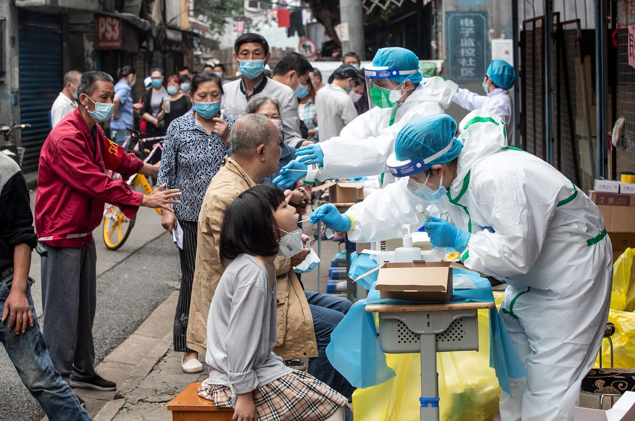 Medical workers take swab samples from residents&nbsp;in Wuhan on May 15.&nbsp;