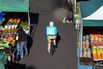 A Deliveroo courier cycles in Croydon, Greater London.