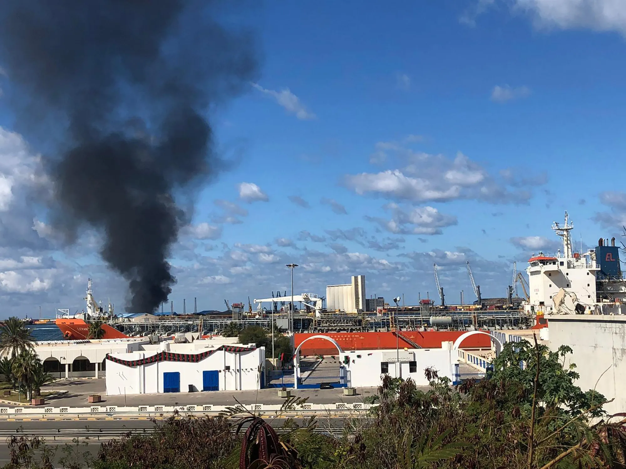 Smoke rises after Khalifa Haftar&nbsp;forces launched an attack on a port near the Martyrs' Square, on Feb. 18..&nbsp;