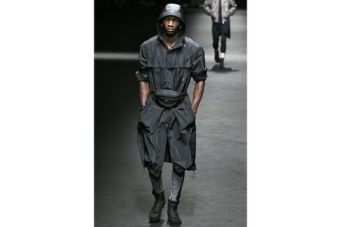 Versace showed a fanny pack as a belt for an outerwear look.