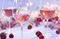 Glass of rosé wine being poured at a picnic setting on a summer's day.