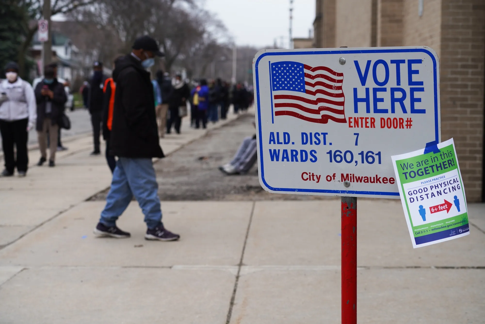 A&nbsp;sign informs voters about social distancing outside a polling station in Milwaukee.