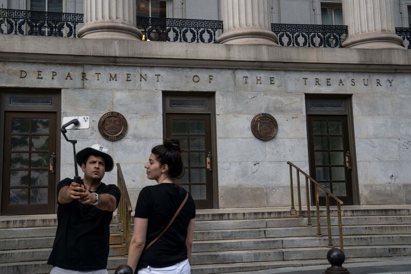 Visitors outside the US Treasury building in Washington, DC, US, on Tuesday, Aug. 15, 2023.