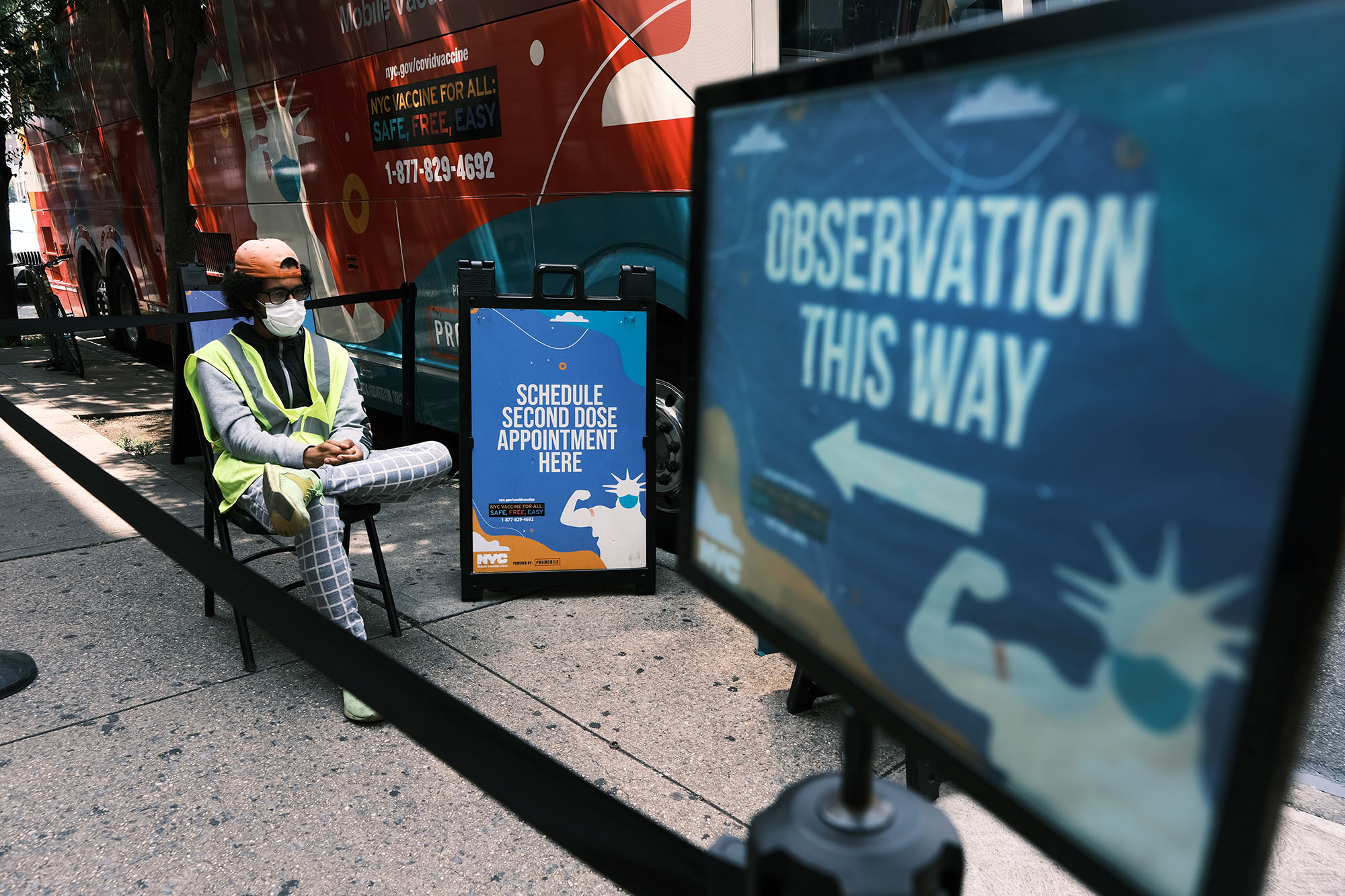 A worker waits for patients&nbsp;outside a city-operated mobile pharmacy&nbsp;in the&nbsp;Brighton Beach neighborhood of Brooklyn, New York.