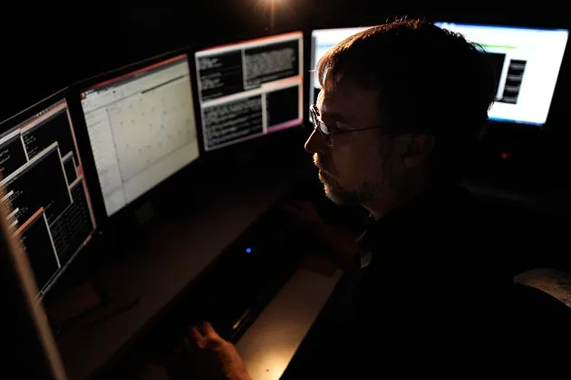 A director of malware research at Dell SecureWorks monitors multiple
computer screens in his office in Myrtle Beach, S.C., hunting for Internet spies
