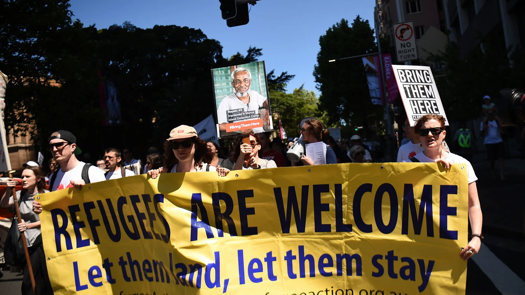 People march in an event organized by Doctors for Refugees to demand humane treatment of asylum seekers and refugees in Sydney on Nov. 5, 2016.
