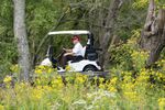 Former President Donald Trump drives a cart at Trump National Golf Club in Sterling, Virginia, on Sept. 12.&nbsp;