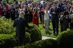 White House staff members applaud as US President Joe Biden walks into the Rose Garden&nbsp;in Washington, D.C. on July 27.