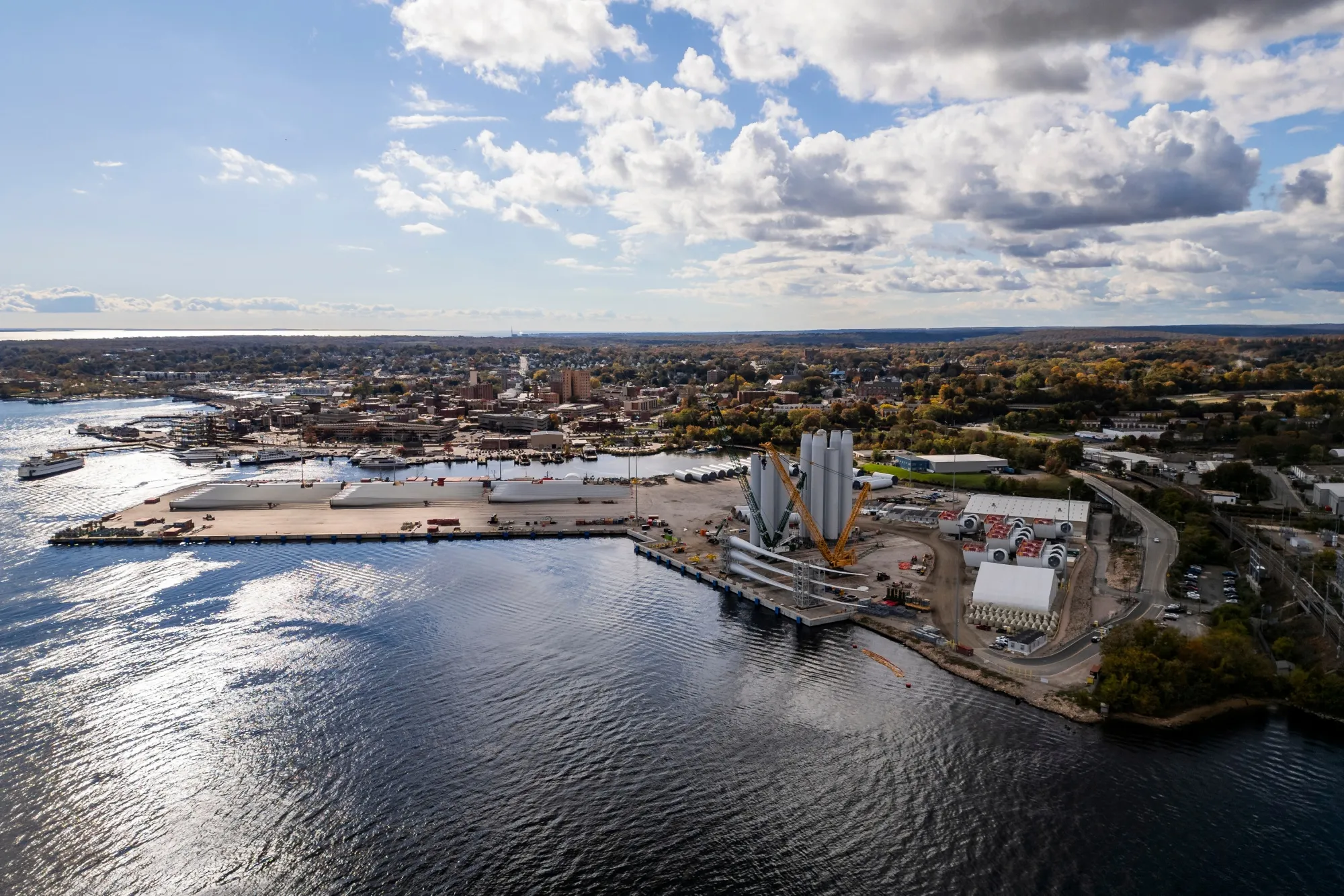 Wind turbine tower sections and blades at the Revolution Wind project assembly site&nbsp;in New London, Connecticut.