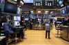 Traders work on the floor of the New York Stock Exchange (NYSE) in New York, U.S., on Tuesday, Feb. 20, 2018.