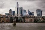 Commuters cross Millennium Bridge in view of skyscrapers on the skyline of the City of London, UK, on Tuesday, Oct. 29, 2024. UK Chancellor of the Exchequer Rachel Reeves will deliver her first budget on Oct. 30. Photographer: Jose Sarmento Matos/Bloomberg