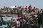 Informal vendors on a footbridge at the Kaneshie Market Complex in Accra.