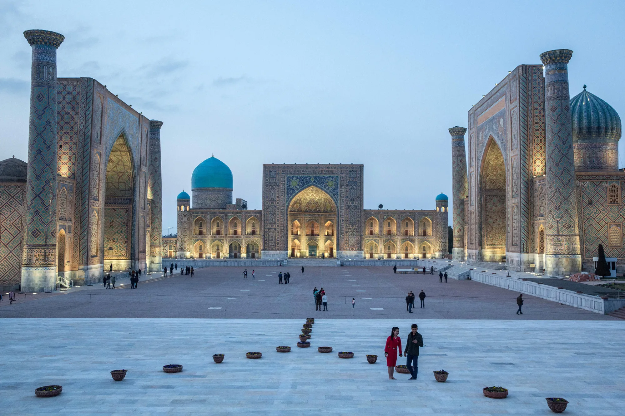 People gather at Registan Square in Samarkand, Uzbekistan.