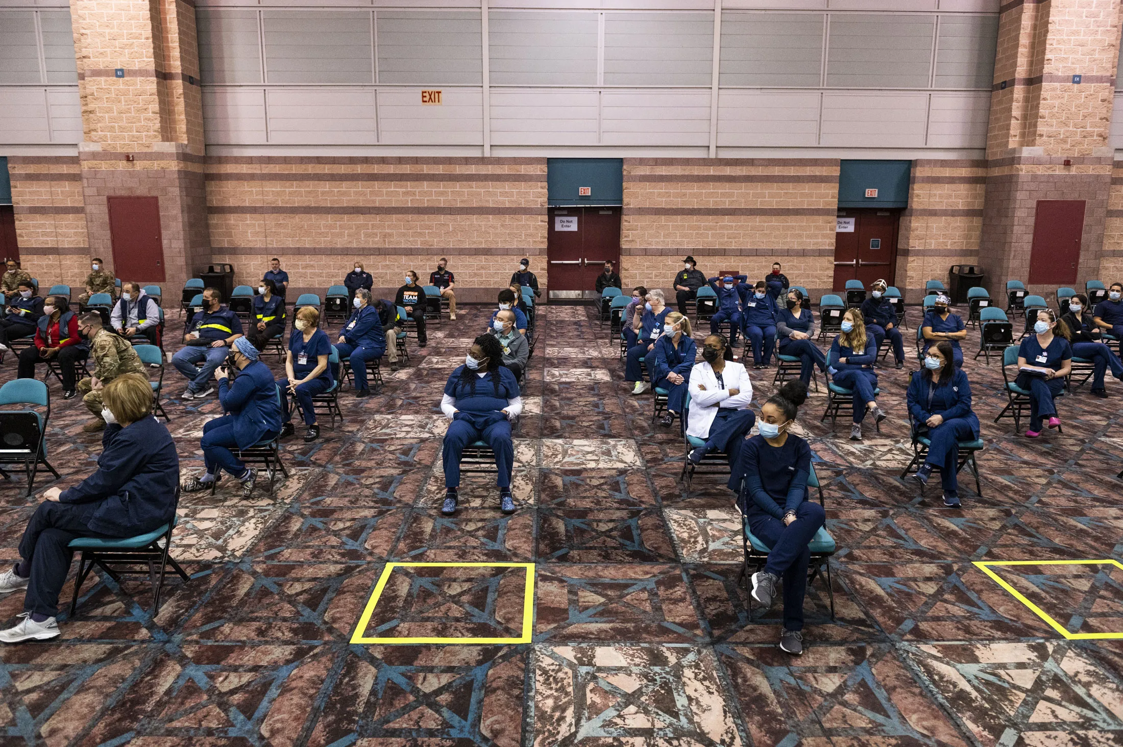 National Guard members, nurses&nbsp;and other staff attend a morning meeting before the Atlantic City vaccination site opens.