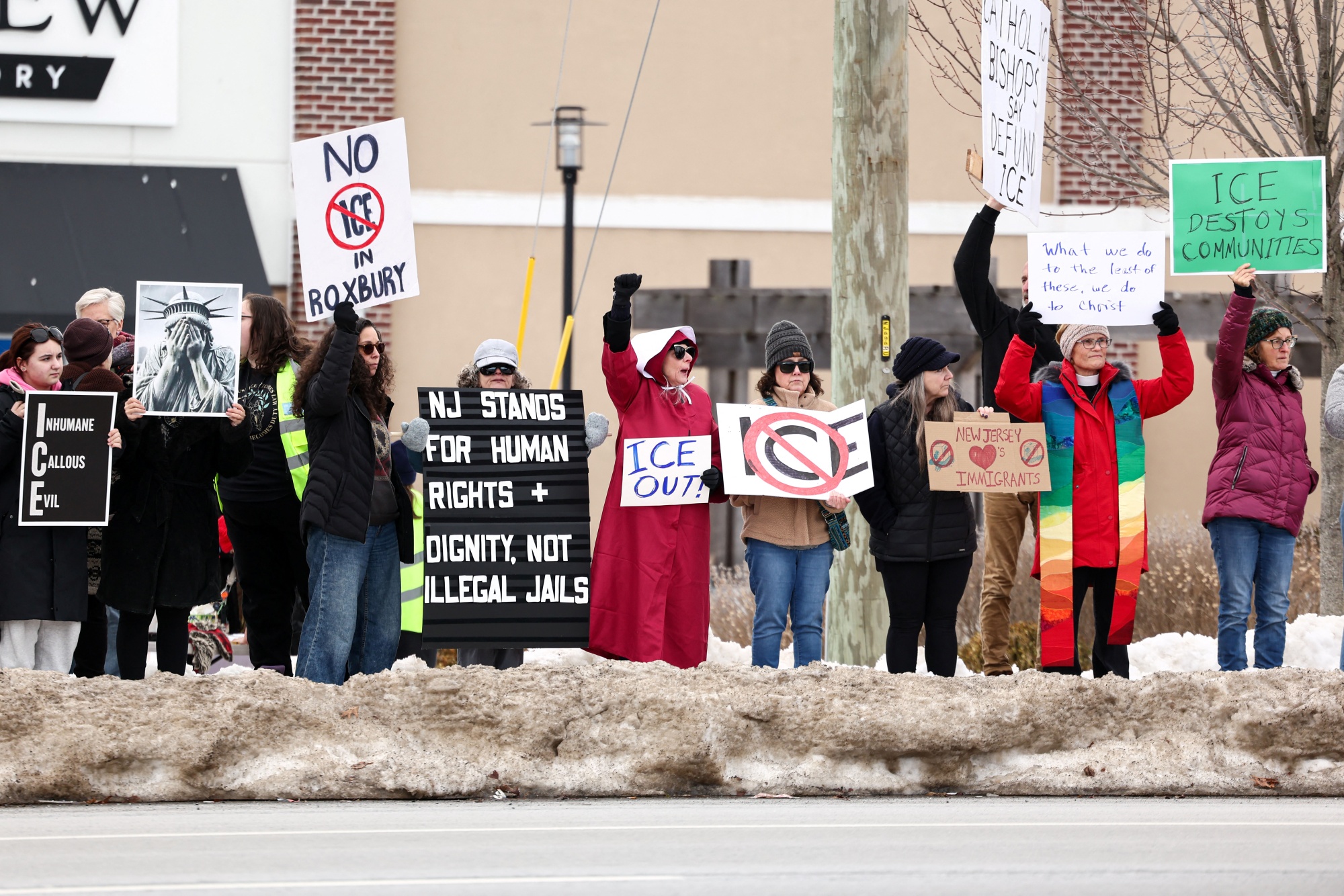 People protest against the planned project of converting a warehouse into a US Immigration and Customs Enforcement (ICE) detention center in Roxbury, New Jersey, on Feb. 16, 2026. Photographer: Charly Triballeau/AFP/Getty Images
