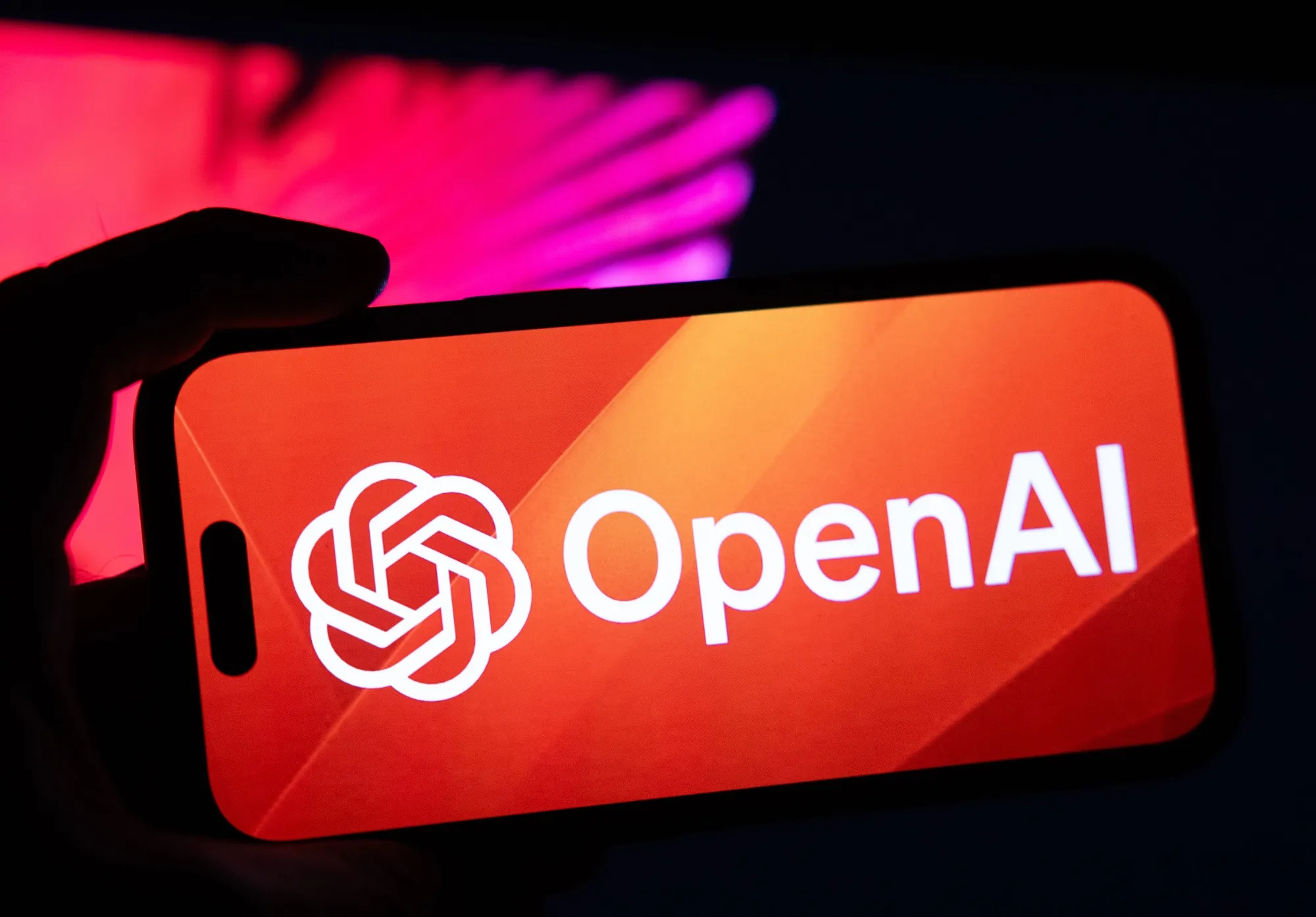 A symbol for the OpenAI virtual assistant on a smartphone.