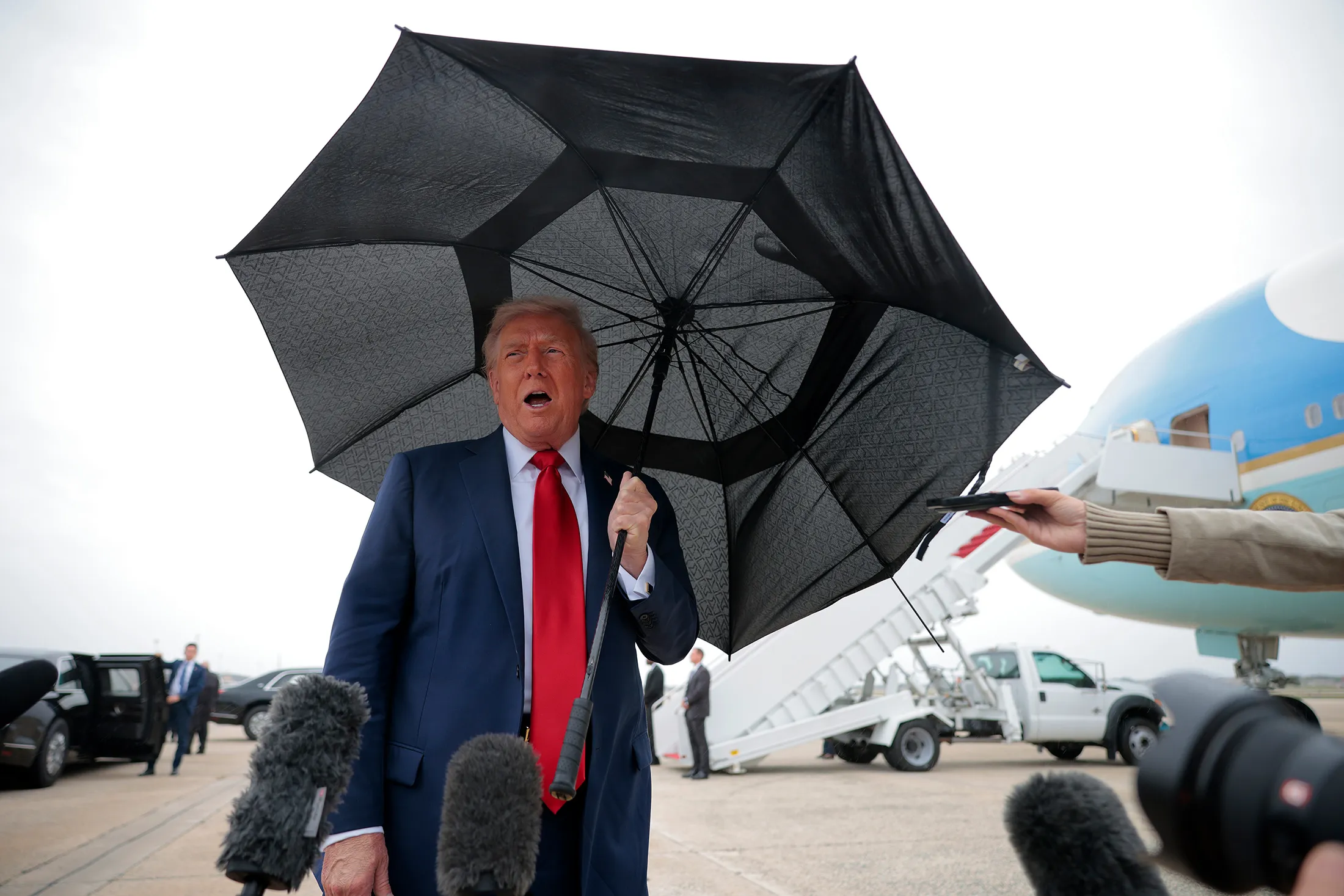 Donald Trump speaks to members of the media before boarding Air Force One at Joint Base Andrews, Maryland, on Oct. 12.