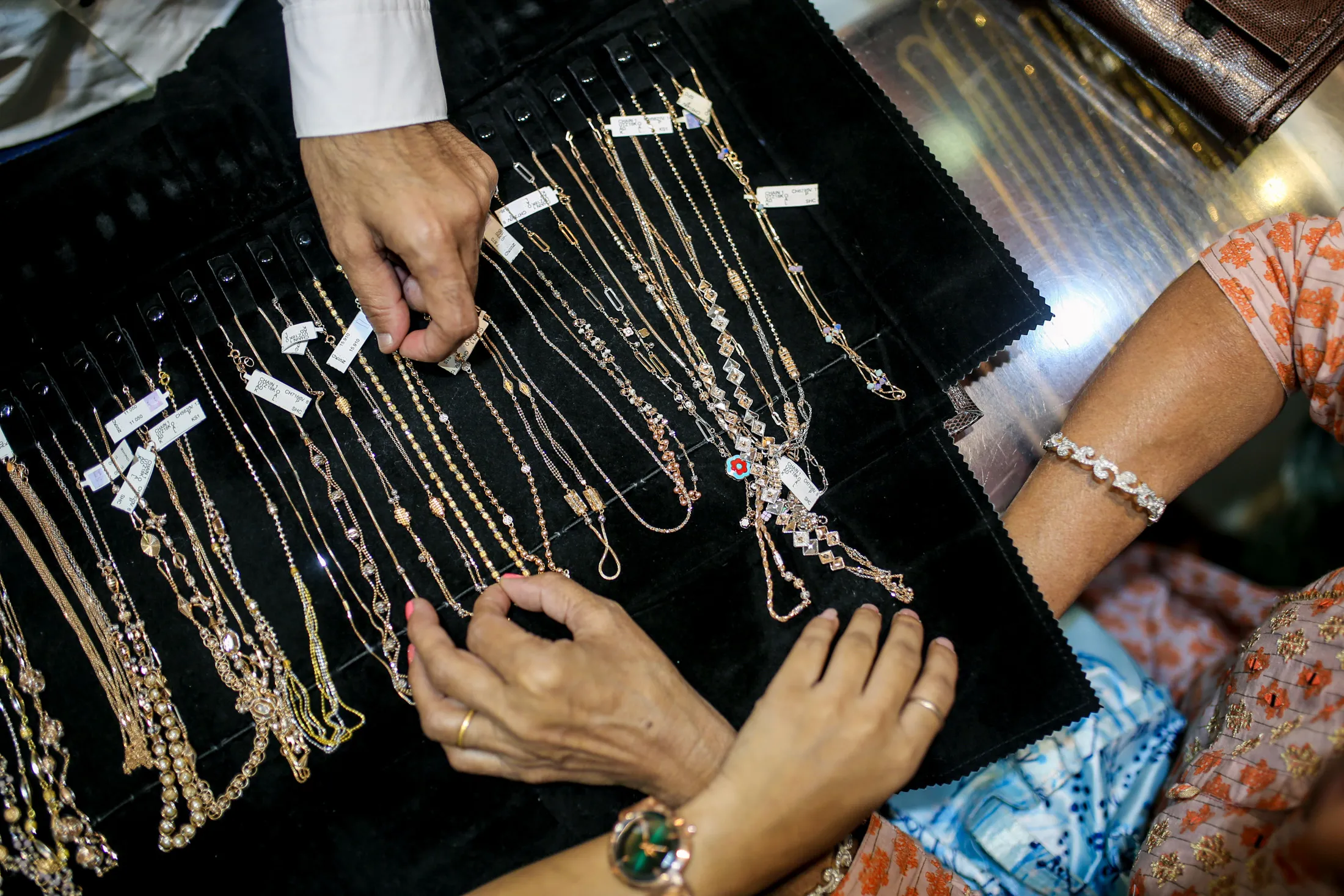 Customers look at necklaces inside a jewelry store&nbsp;during the festival of Dhanteras in Mumbai. Personal loans backed by gold surged 35% in the 12 months to June in India.