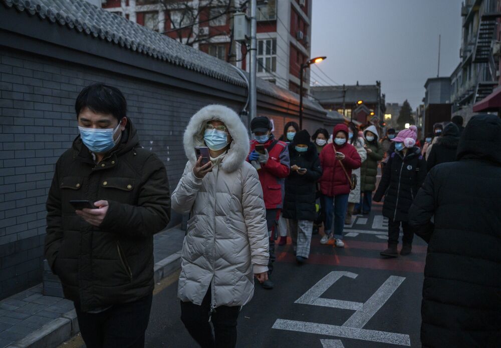 Residents of Dongcheng District in Beijing line up for Covid-19 testing on Jan. 22. China’s lockdowns are also getting tougher, rivaling the severity of curbs placed on Wuhan a year ago.