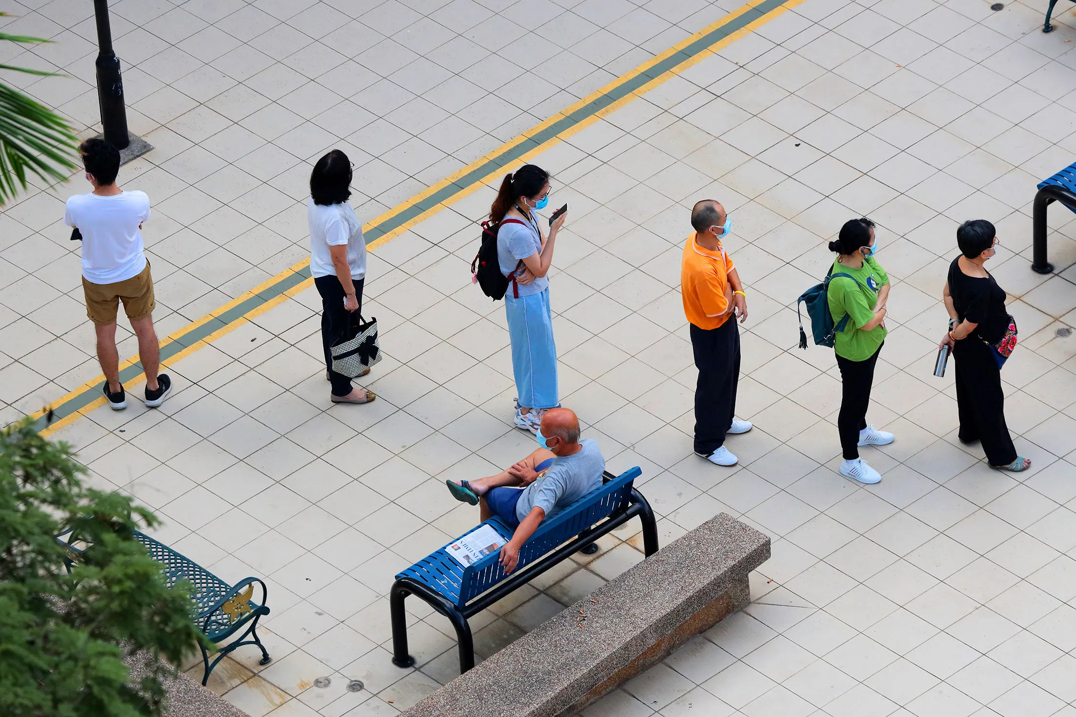 People in Singapore wait in line to register for a dose of&nbsp;Sinovac’s Covid vaccine on June 24.