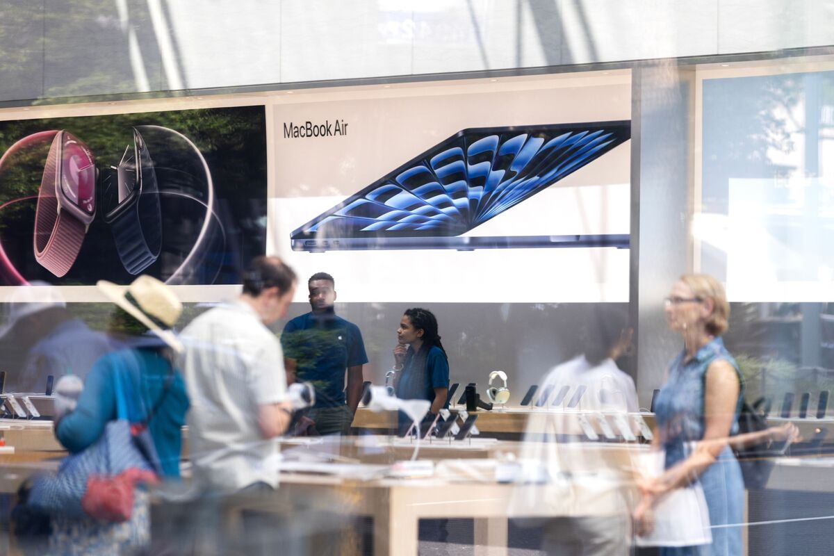 'a group of people in front of a store window'