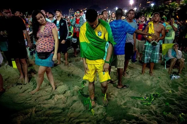 Brazilian soccer fans watch their team against Germany during the FIFA World Cup on July 8 in Rio de Janeiro