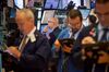Traders work on the floor of the New York Stock Exchange (NYSE) in New York, U.S., on Monday, June 11, 2018. U.S. equities crept higher while European stocks rose as investors eased into a hectic week during which three major central banks set interest rates, President Donald Trump meets North Korea's leader and Brexit returns to the fore.