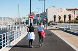 Joggers run along a promenade in Marseille.
