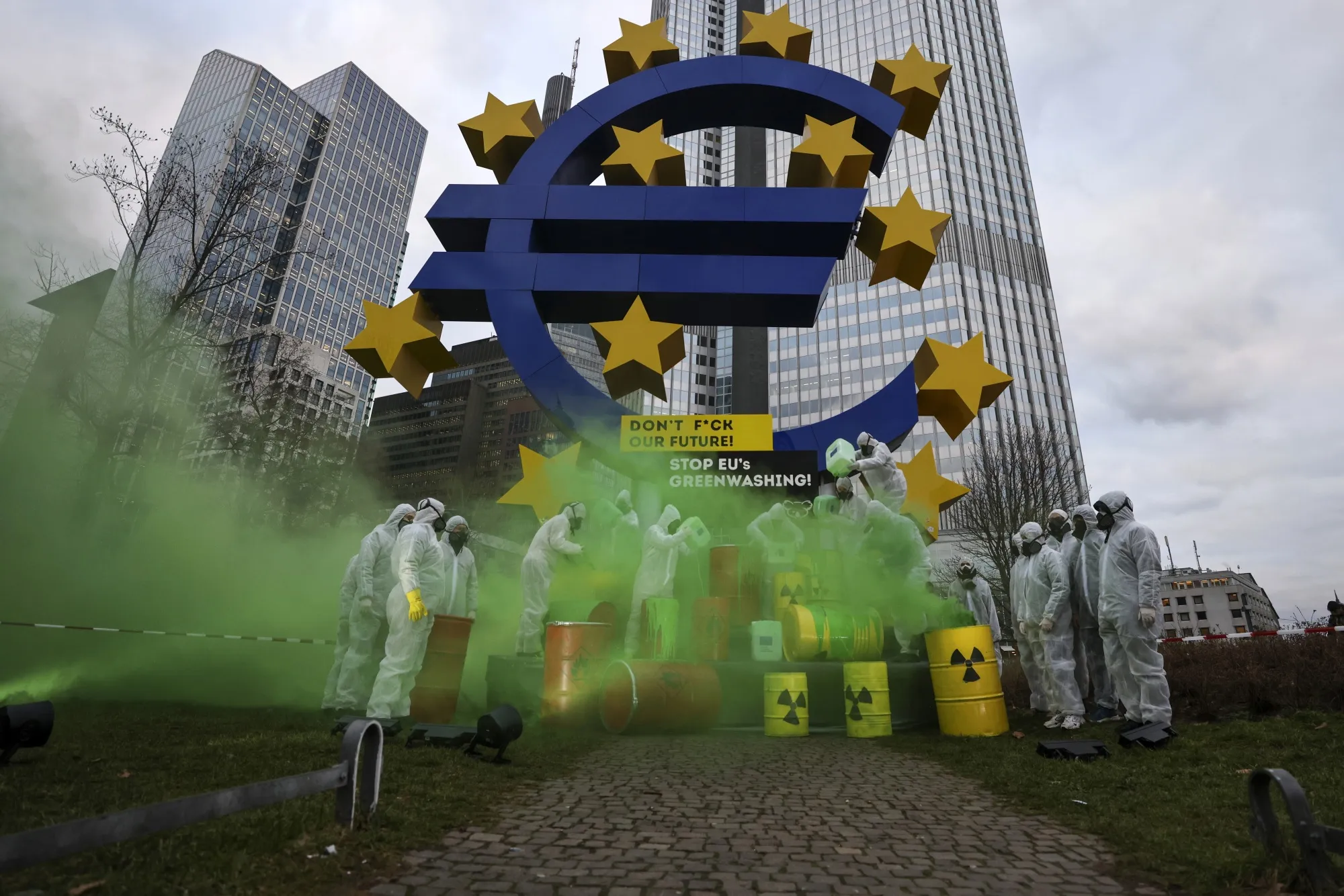 A protest against greenwashing next to the Euro Sculpture in Frankfurt, Germany.
