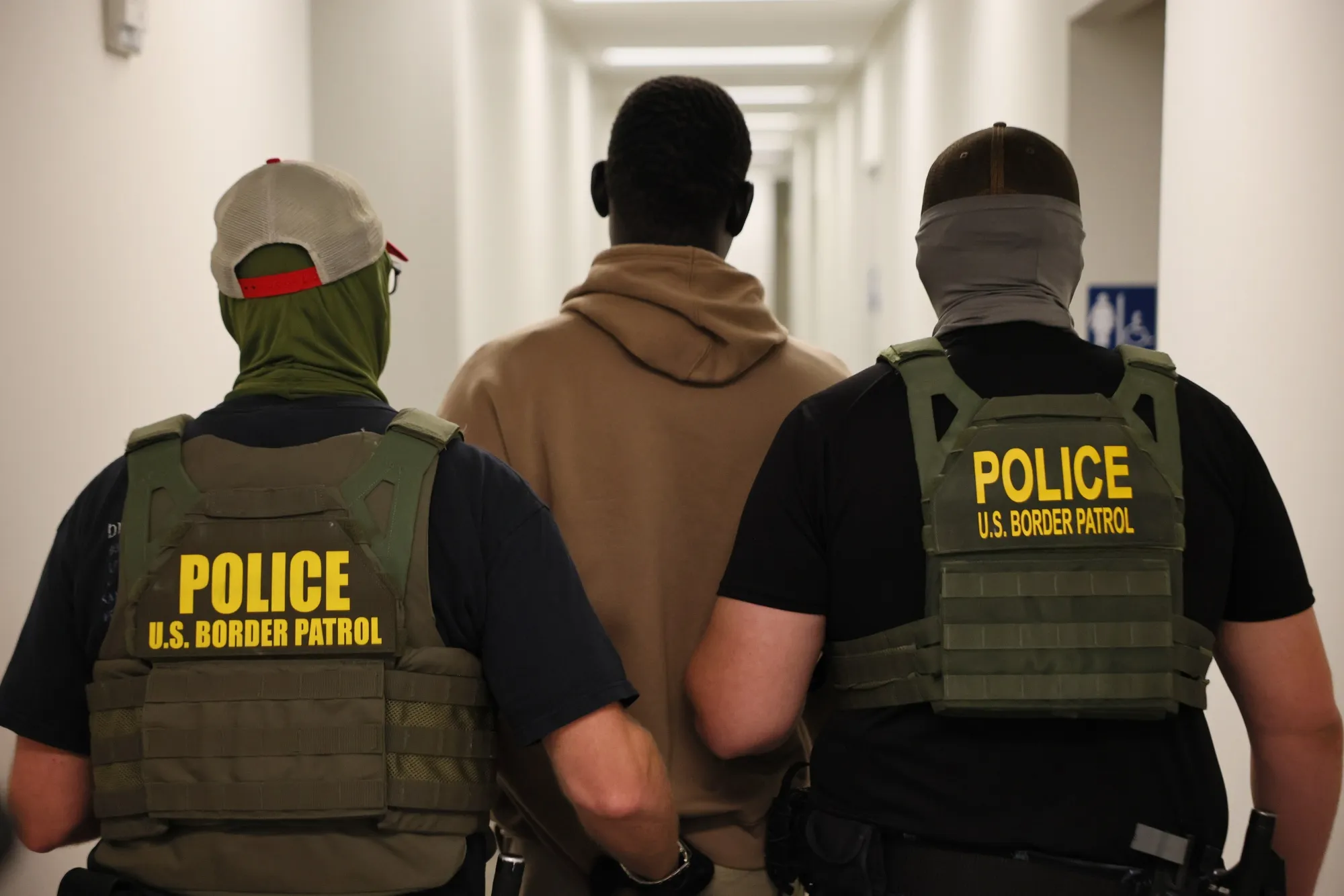 Federal agents detain a man after his court hearing in immigration court at the Ted Weiss Federal Building&nbsp;in New York City, on July 9.