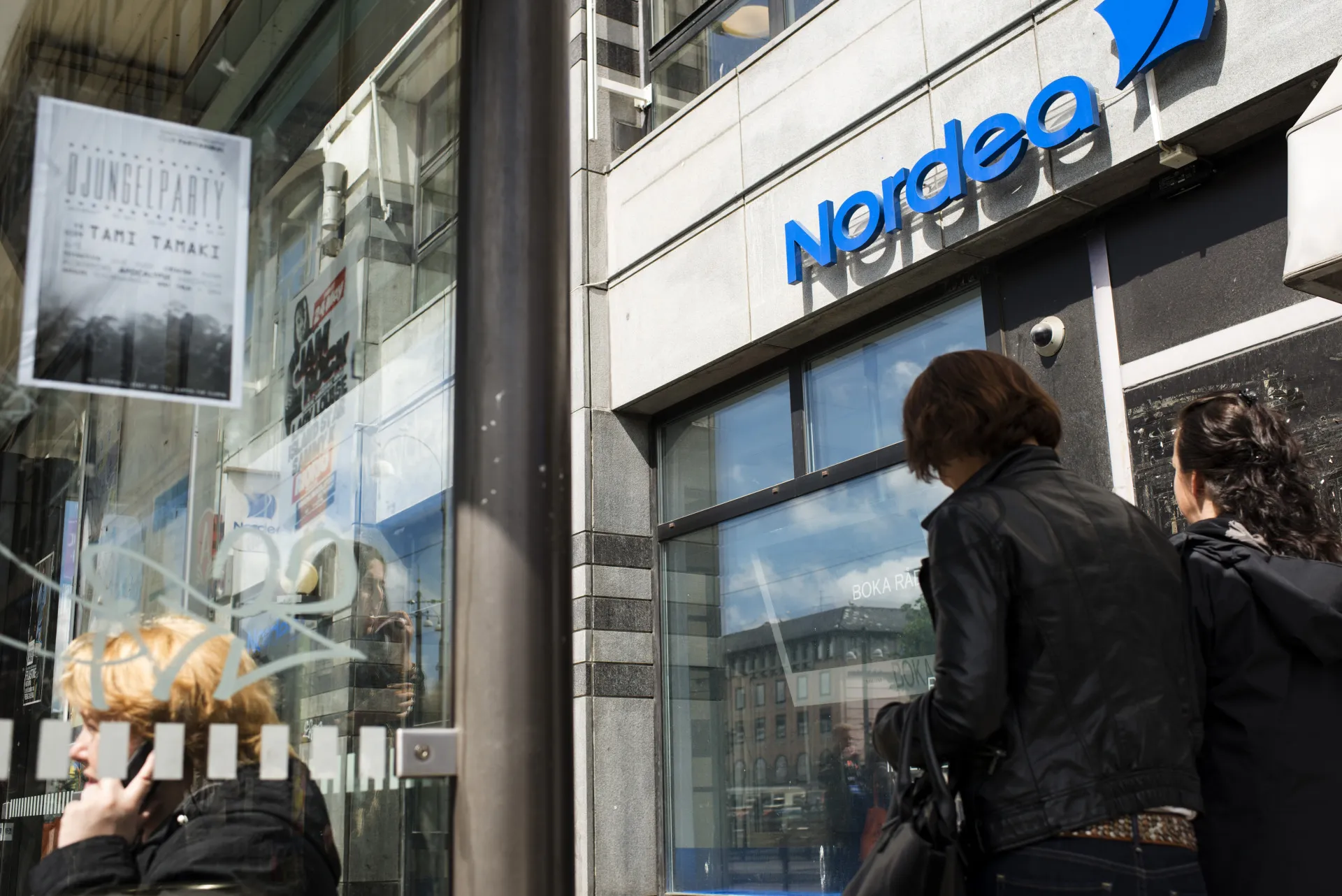 Pedestrians pass a Nordea Bank AB bank branch in Gothenburg, Sweden.