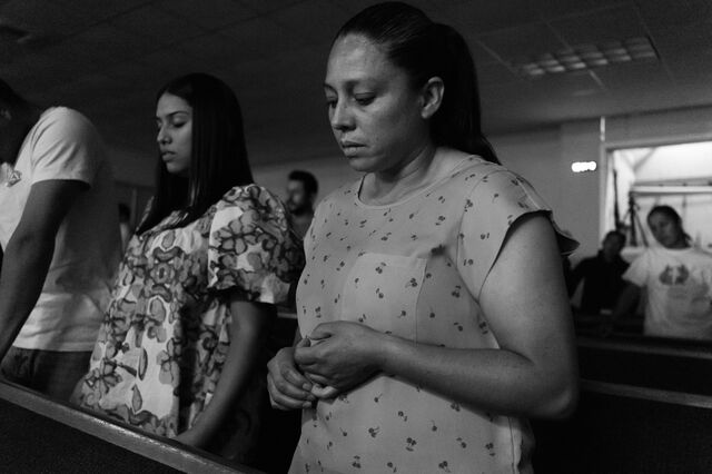 Nunez prays with her daughters and her daughter’s boyfriend at Iglesia Manantial De Bendiciones. 