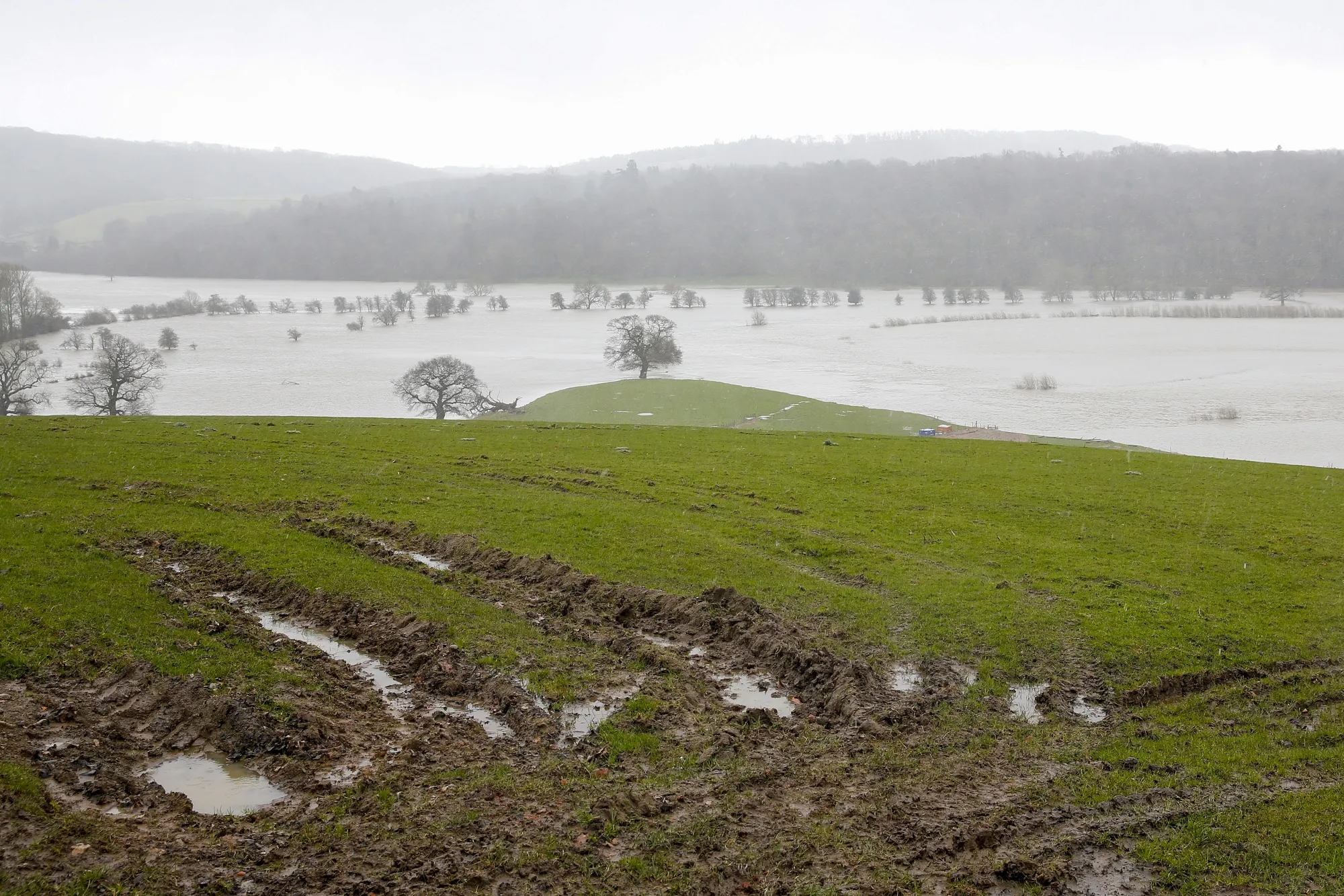Water floods into farm land following heavy rain from Storm Jorge near the River Severn in Ironbridge, U.K., on Saturday, Feb. 29, 2020. Two winter storms since the beginning of February -- Ciara and Dennis -- have pushed rivers to record levels, leaving large areas of land inundated and flooded more than a thousand homes.