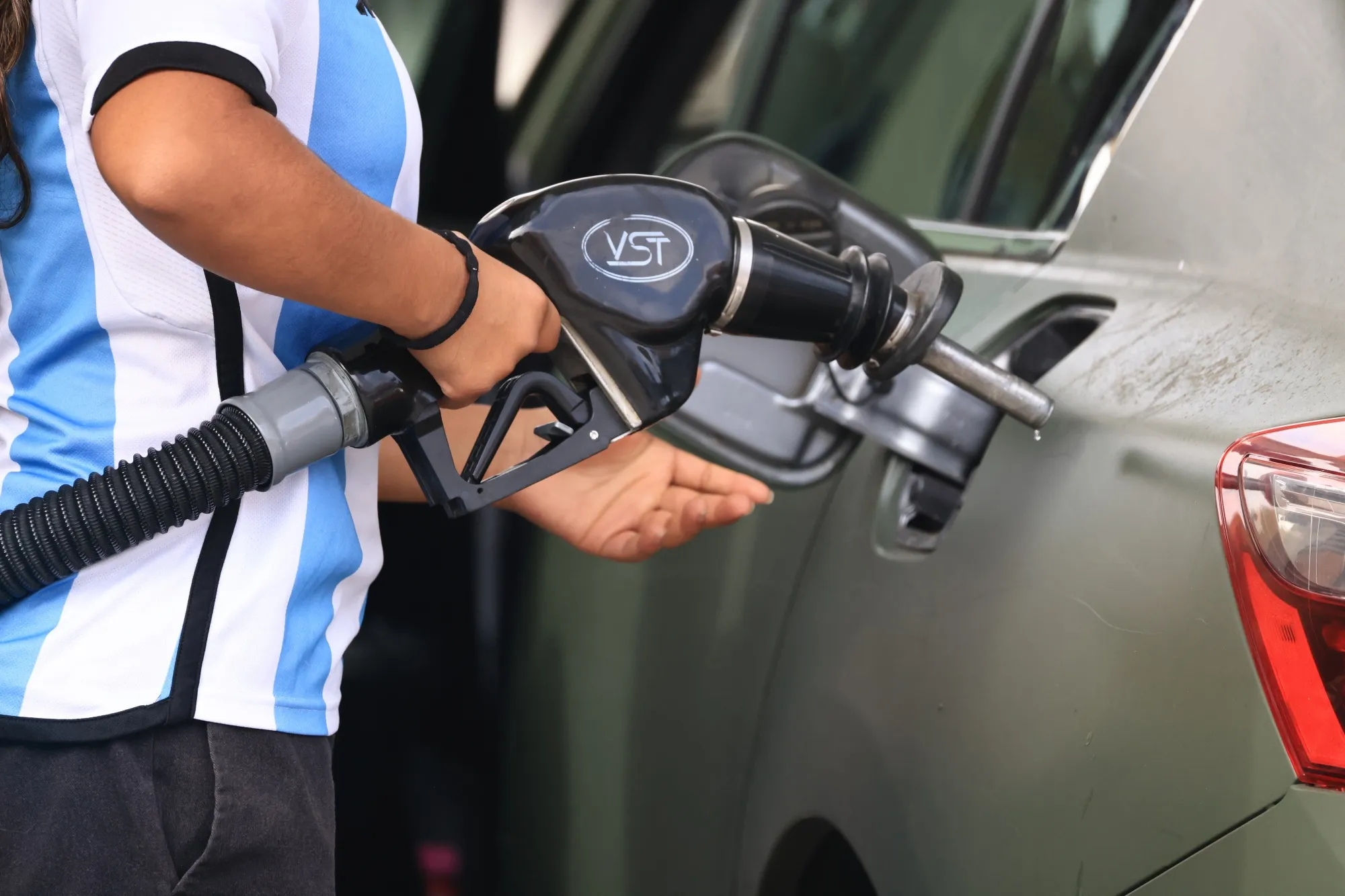 A driver refuels a vehicle at a gas station in Los Angeles.
