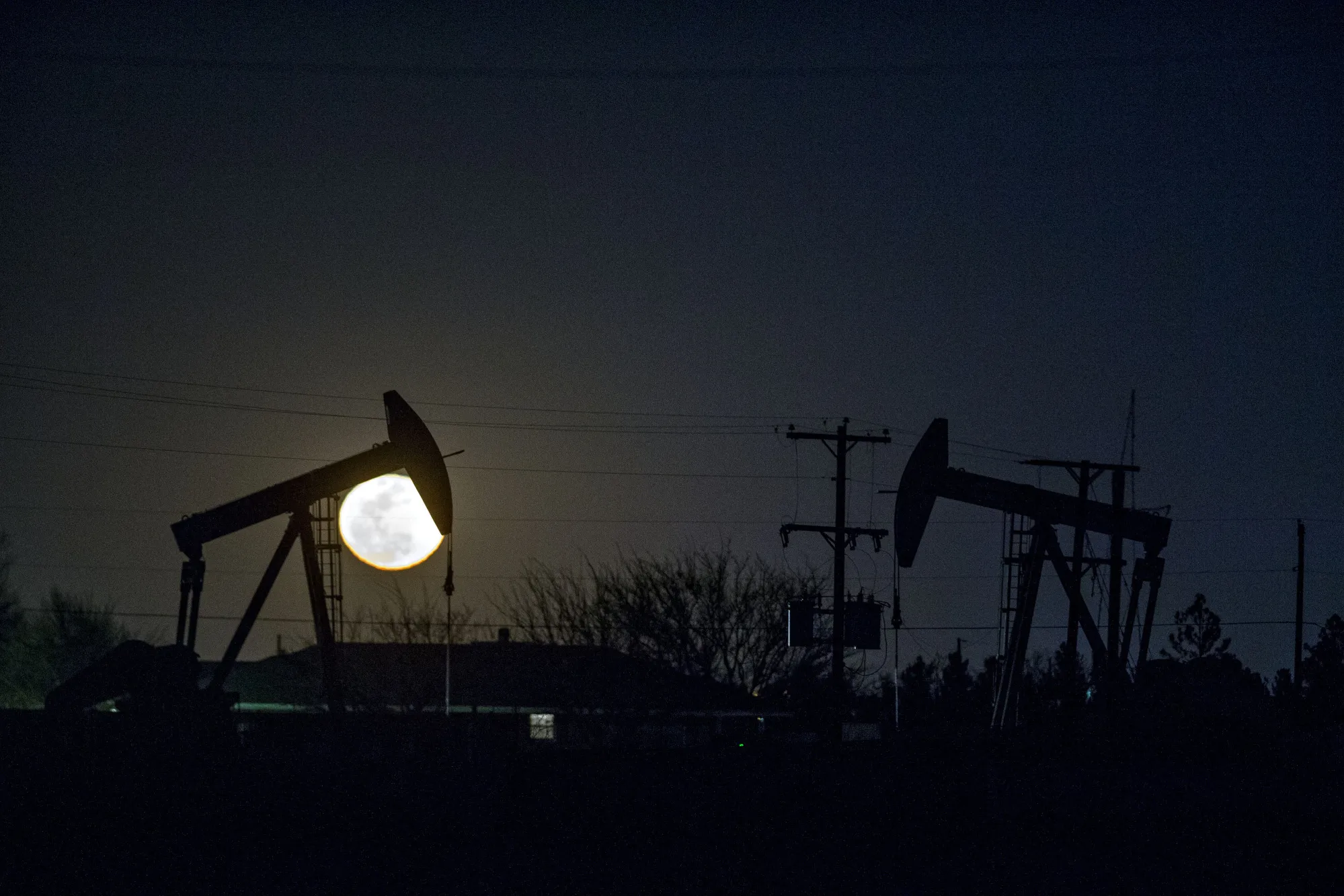 The silhouette of oil pump jacks