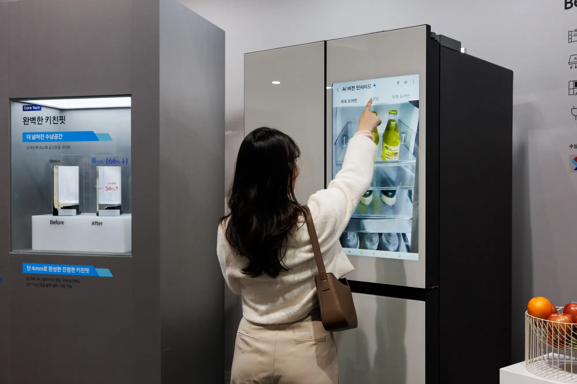 An attendee interacts with a Samsung AI refrigerator during the company’s Bespoke AI event in Seoul on March 28.