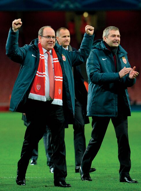 Rybolovlev, right, and Prince Albert II celebrate Monaco FC’s win over Arsenal in London on Feb. 25—the same day Bouvier was arrested.