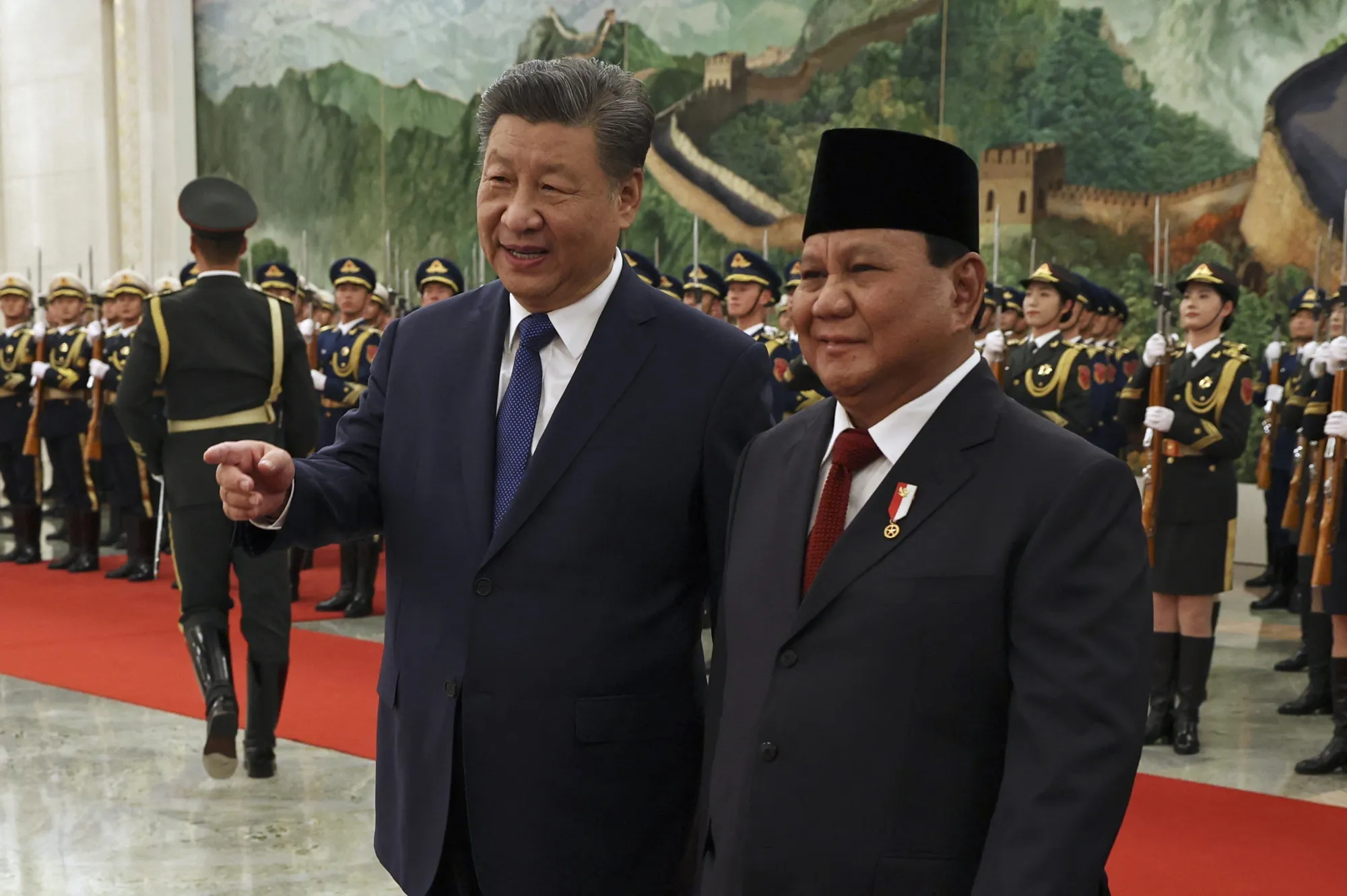 Xi Jinping, left,&nbsp;and&nbsp;Prabowo Subianto attend a welcome ceremony at the Great Hall of the People in Beijing, on Nov&nbsp;9.