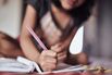 Young girl (4-5 years) writing