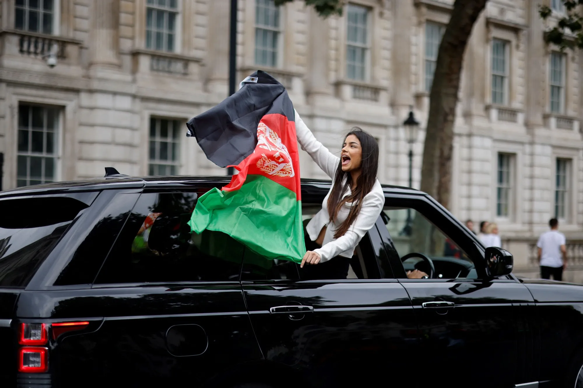 Protestors march in solidarity with the people of Afganistan in central London.